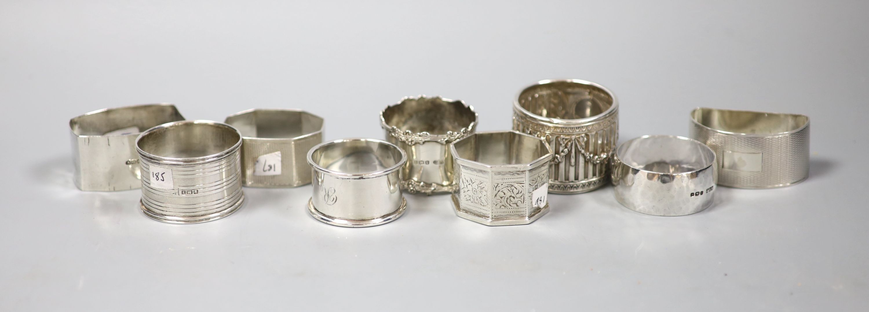 Nine assorted silver napkin rings, 7oz.